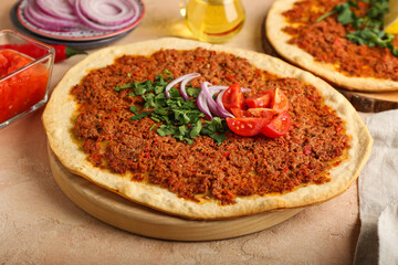 Board with delicious Turkish pizza on color background