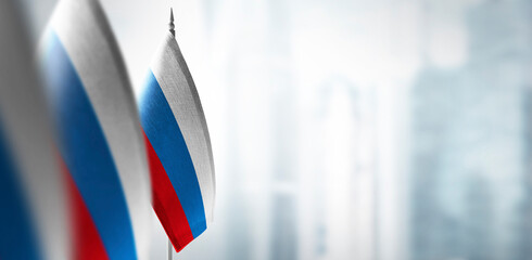 Small flags of Russia on the background of a blurred background