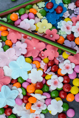 small and colorful sweet candies on gray background