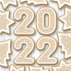 Christmas gingerbread cookies with the date 2022 on a white background. New year greeting card. View from above. Christmas vacation. Xmas festive holiday.