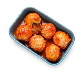 Baking dish with delicious meatballs and melted cheese on white background