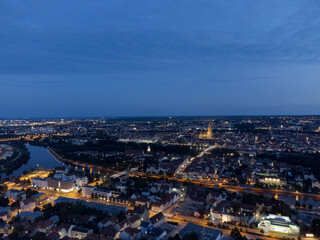 Aerial view of world famous skyline of Regensburg in Bavaria, Germany with cathedral and old town at night