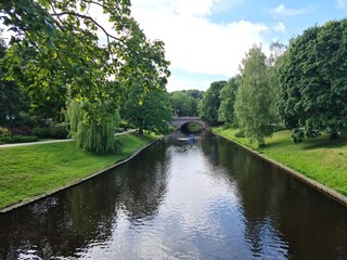 Obraz premium Picturesque city water canal along which tourists and residents take boat trips