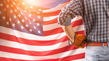 Worker on nation flag background. Labor day holiday concept. USA
