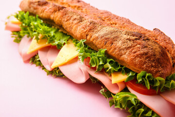 Tasty ciabatta sandwich on color background, closeup
