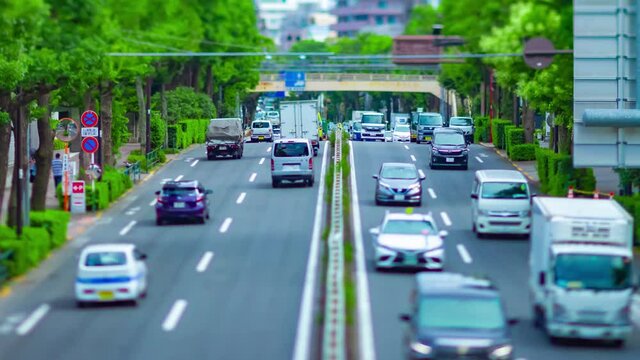 A timelapse of miniature downtown street at the avenue daytime tiltshift zoom