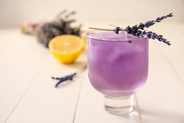 Glass of fresh cocktail with lavender on table