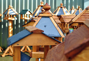 Close Up Display of Wooden Garden Bird Tables 