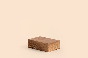 Minimal rectangular wooden geometric podium. Wooden saw cut rectangular shape on beige background. Scene with geometrical forms. Empty showcase for product presentation