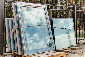 New sealed glass units at building site. Storage and preparation at the installation of windows.