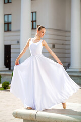 young ballerina dancing in the street © Andrey_Arkusha