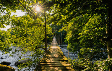 Suspension Bridge over Morrum river in southern Sweden. Popular destination for anglers.