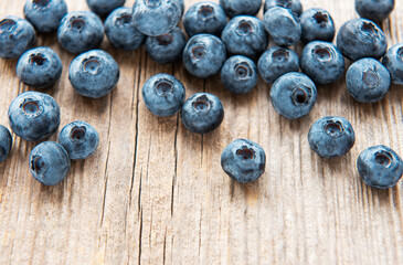 Blueberries on vintage wooden brown background