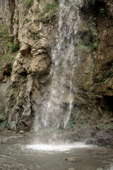 Fototapeta na wymiar Beautiful mountain waterfall on rainy day