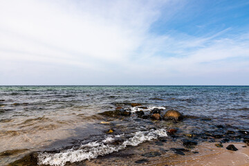 Blue sky with white clouds over the sea