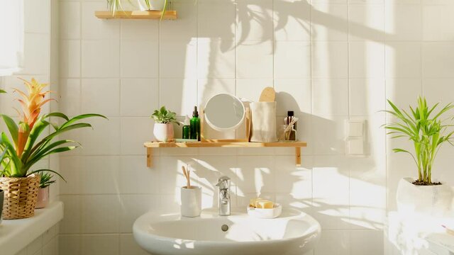 Time lapse of shadow movement in modern white bathroom in eco-friendly sustainable style during sunset untill darkness. Zero waste, sustainability. 4K UHD