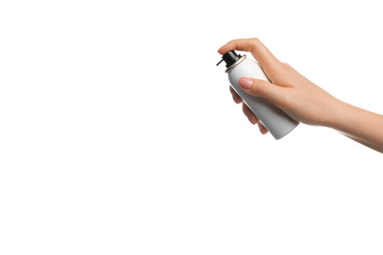 Aerosol in a female hand on a white background