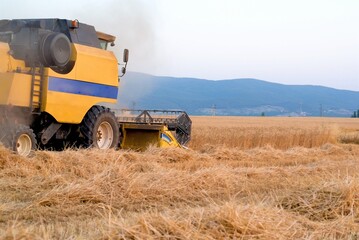 combine harvester working on a wheat field