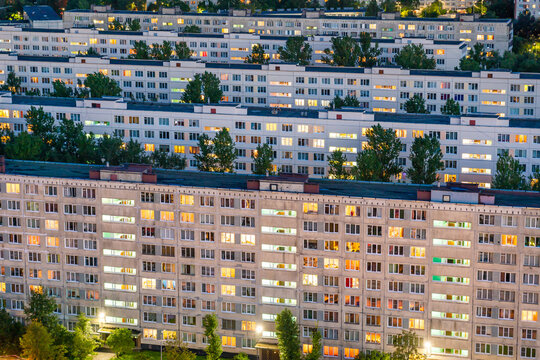 Timelapse of residential quarters of the night city with the lights on from the windows of the apartments.