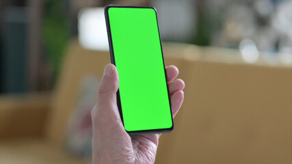 Close up of Old Man Holding Smartphone with Chroma Screen