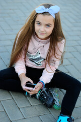 beautiful teenage girl with long hair wearing blue glasses and a plaid shirt portrait