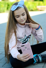 beautiful teenage girl with long hair wearing blue glasses and a plaid shirt portrait