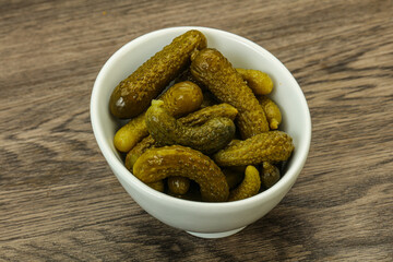 Pickled gherkin in the bowl