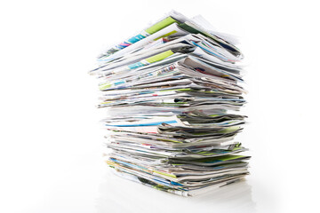 Stack of waste paper, old magazines, newspapers and leaflets for recycling.
