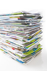 Stack of waste paper, old magazines, newspapers and leaflets for recycling.