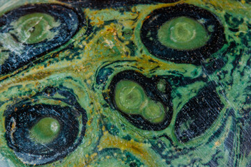 Macro mineral stone jasper kambaba on a white background