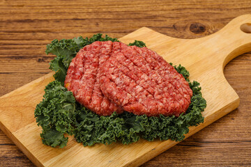 Raw beef burger cutlet for cooking