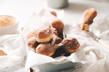 Mini donuts with powder sugar and coconut