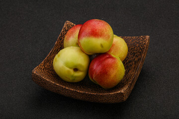 Sweet small nectarines in the basket