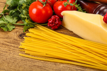 Raw Italian spaghetti heap with cheese
