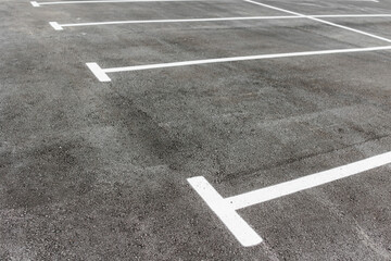 Parking on the street next to the house. new paved empty parking lot with new painted lanes © Anna