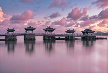 Fototapeta premium The famous ancient landmark, Guangji Bridge, in sunrise. The bridge locates at Chaozhou, Guangdong, China.