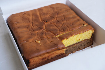 Delicious layered sponge cake inside a box