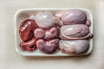 Raw testes and kidneys of an adult ram and lamb