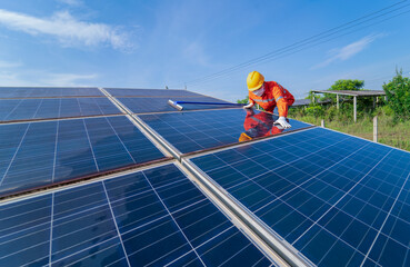 washing the surface of the solar panels which are so dirty with dust and pigeon's droppings on the roof