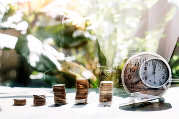 stacking dollars coins with a house model.save and investment for buy house concept . pastel tone.