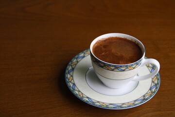 Cup of coffee on table, hot frothy drink,Turkish coffee