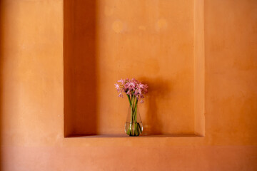 Vase of wilting dying flowers