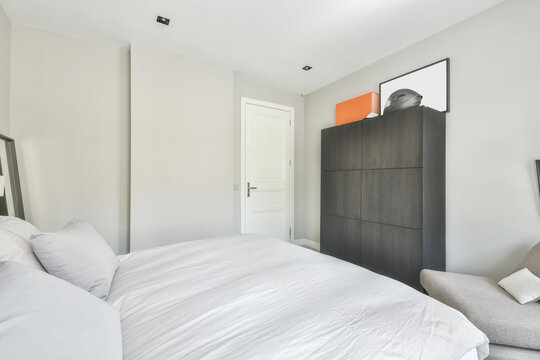 Bedroom interior with bed and wardrobe