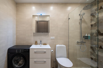 Modern interior of bathroom in apartment. Toilet and shower.