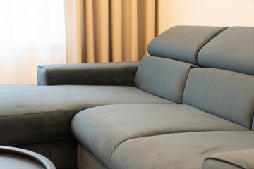 Close-up of soft cozy couch in living room. New modern furniture.