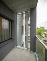 Fototapeta premium Balcony in luxury residential complex. Modern design. Metal partition.