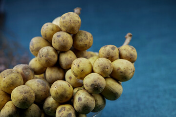 closeup bunch of ripe Longkong fruit on table