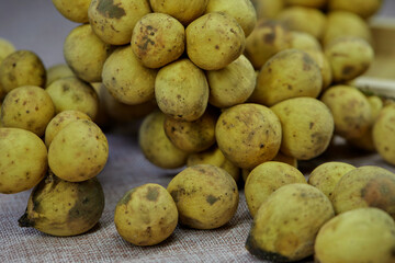 closeup bunch of ripe Longkong fruit on table