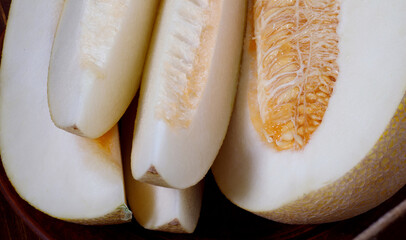 Slices of ripe melon and half melon.