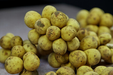 closeup bunch of ripe Longkong fruit on table